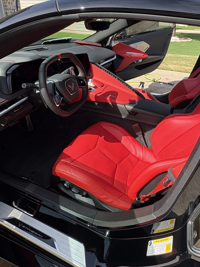 Corvette C8 Stingray cabin with red leather seats and carbon trim cleaned and conditioned