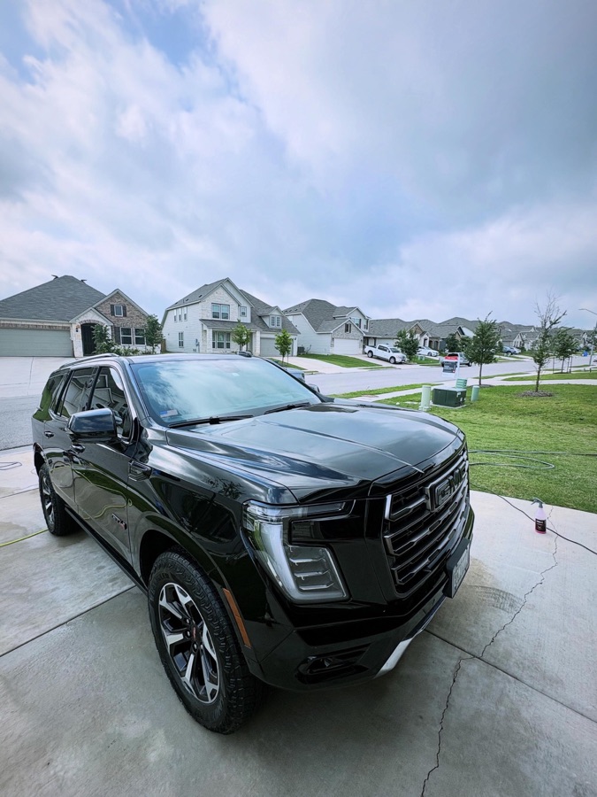 Glossy black GMC Yukon after a full exterior detail by No Cap Detailing