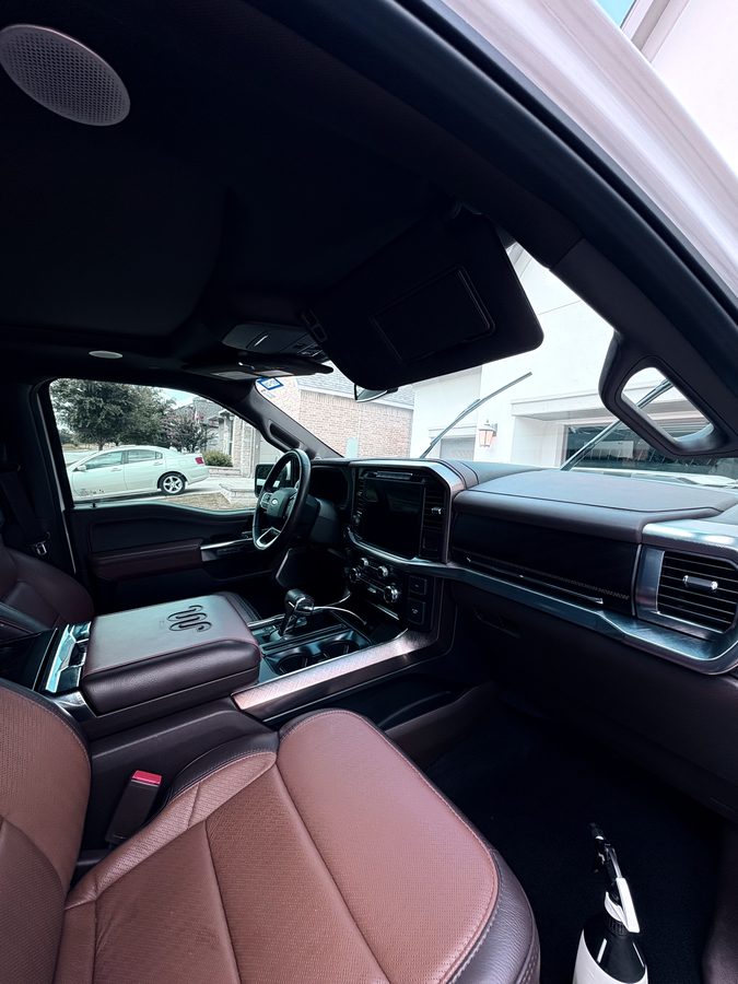 Ford F-150 King Ranch cabin with saddle leather console after an interior detail