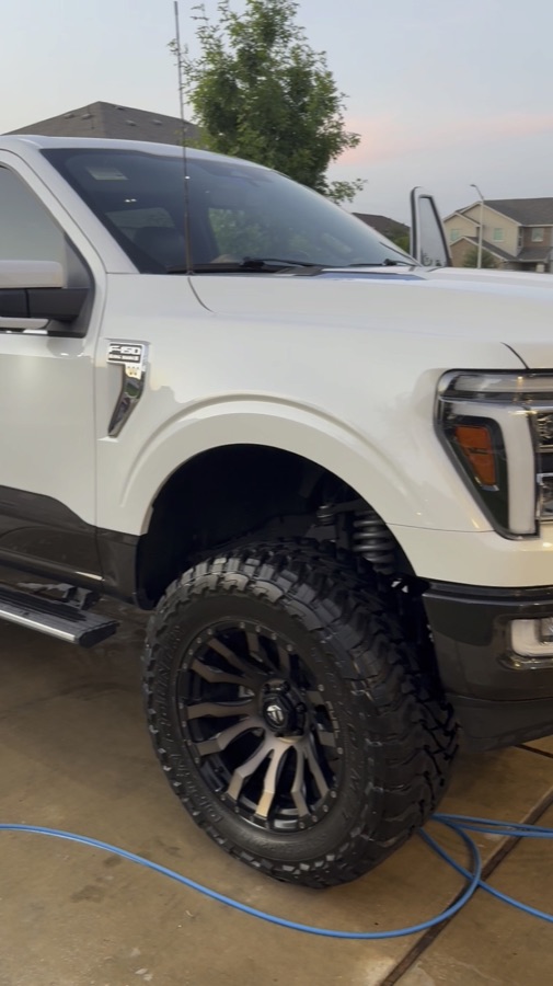 White lifted Ford F-250 Super Duty after an exterior detail