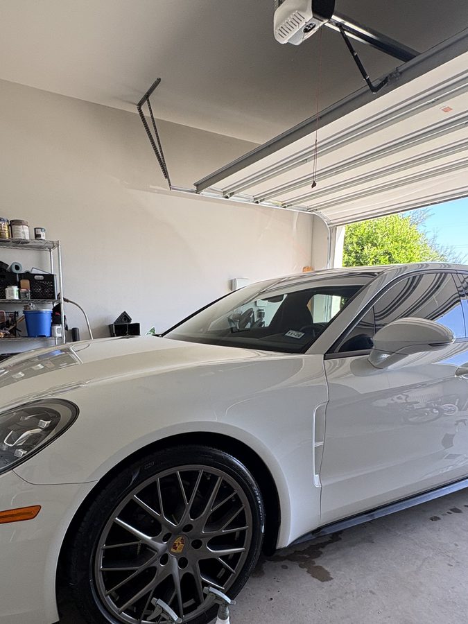 White Porsche Panamera front three quarter with a fresh gloss finish after an exterior detail