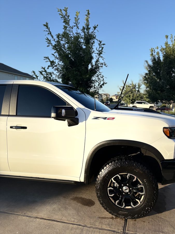 White Chevrolet Silverado ZR2 Duramax on off road tires after an exterior detail
