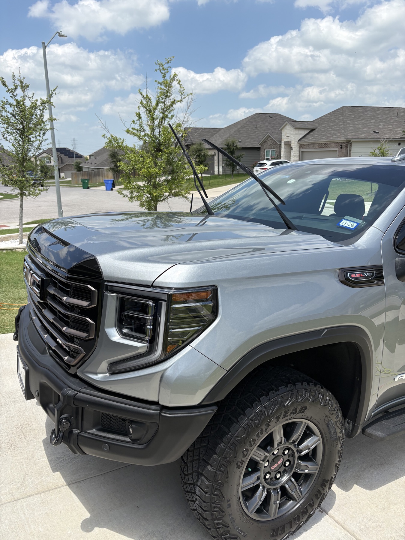 Silver GMC truck exterior with polished hood and wheels