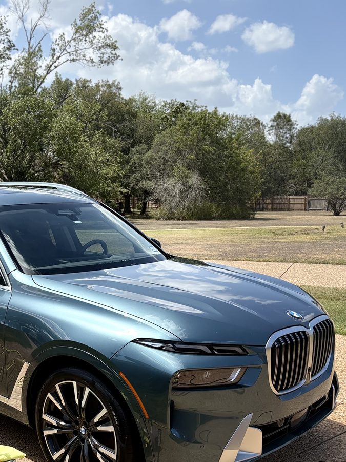 Blue BMW X7 xDrive40i front three quarter with a mirror gloss finish after a full detail